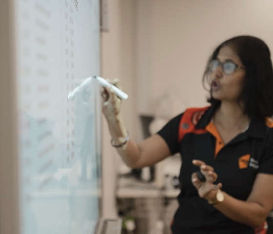 lecturer writing on white board 