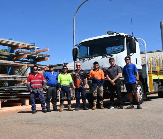 students and lecturer with training truck