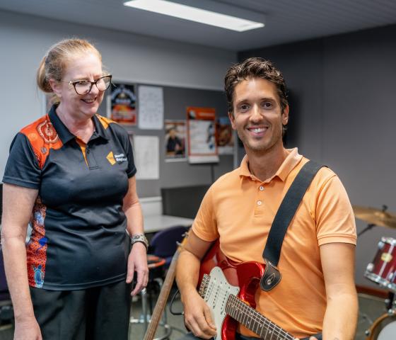 Student playing guitar