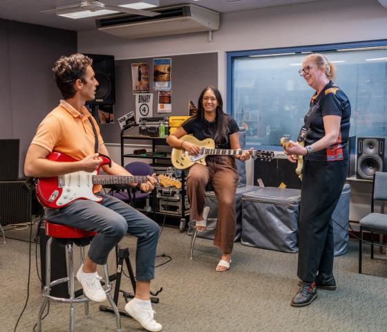 Students playing guitar